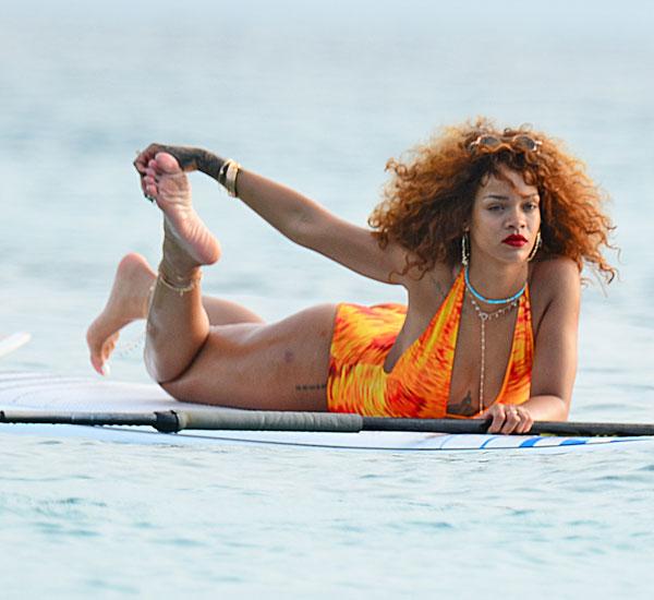 Rihanna swimsuit paddleboarding photos 01