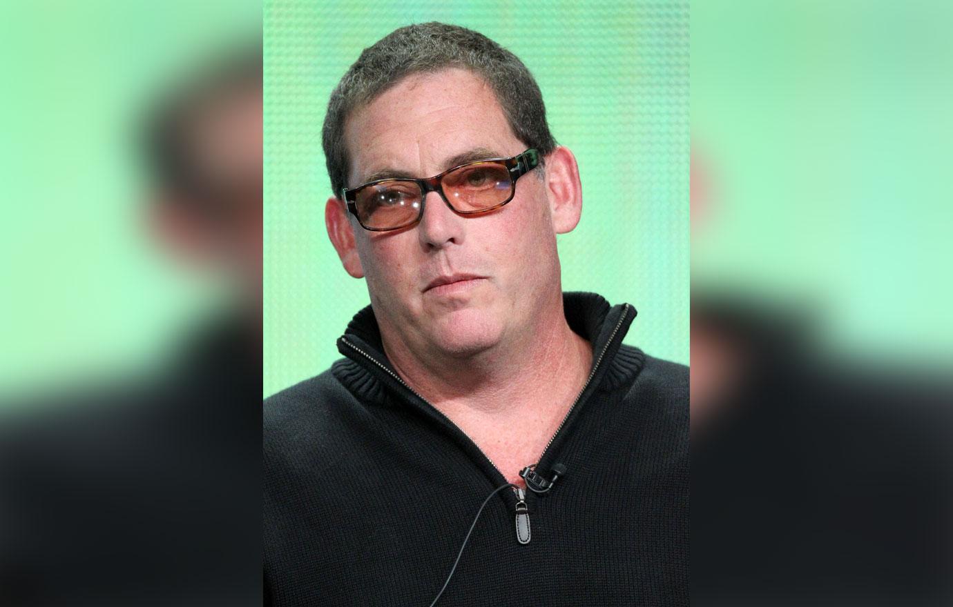 Mike Fleiss Standing In Front Of Green Background