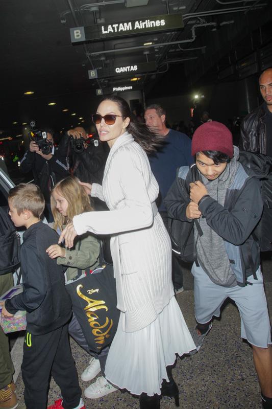 Angelina Jolie touches down at LAX with her brood