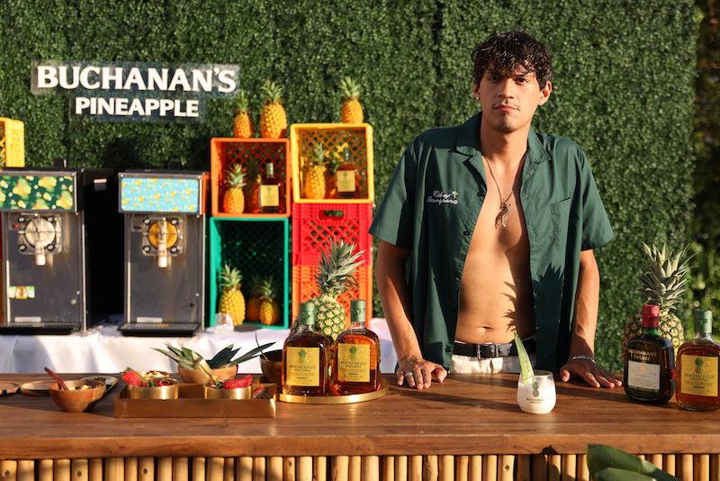 omar apollo toast with buchanans pineapple at buchanans summer kickoff party in miami