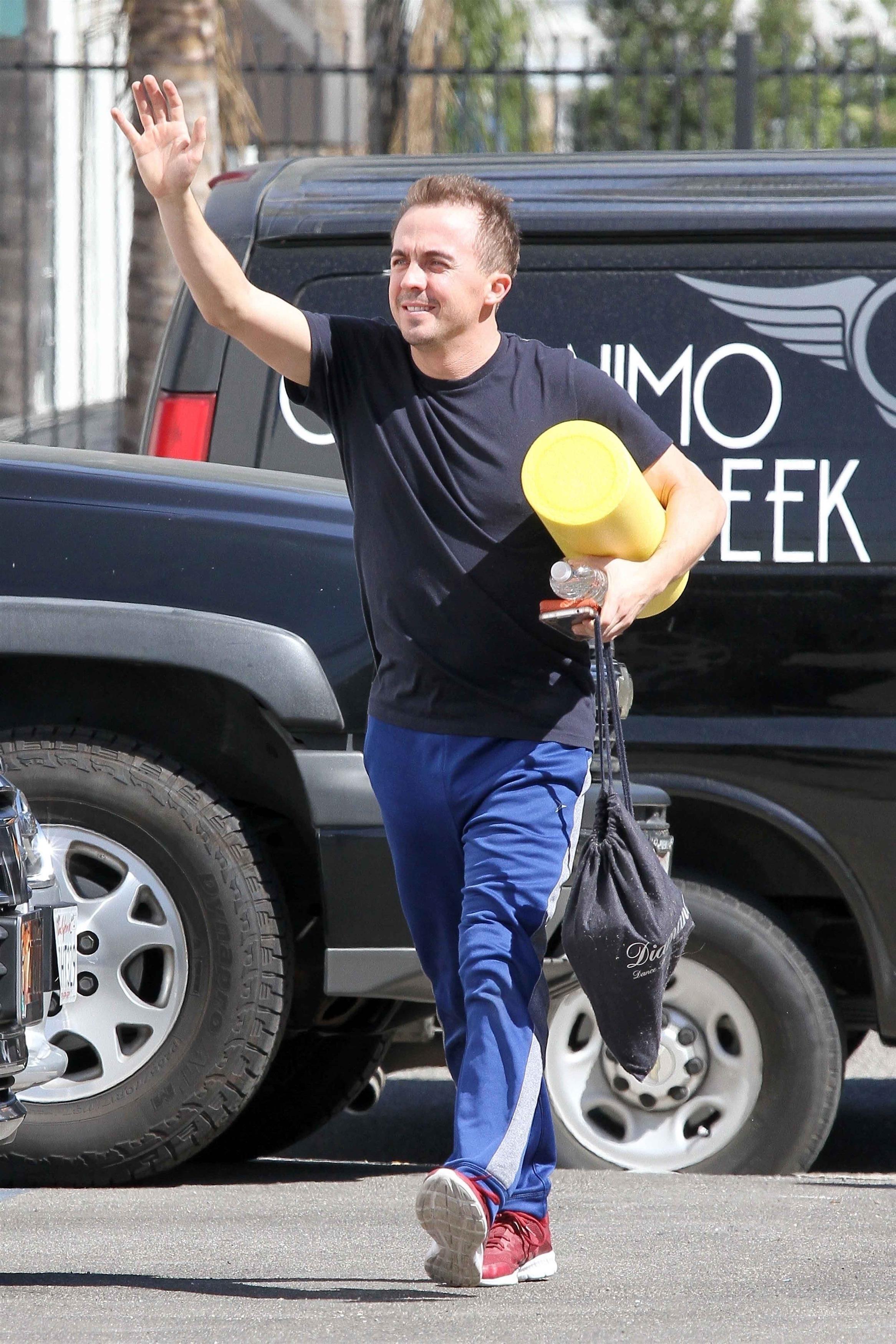 Frankie Muniz and Witney Carson all smiles as they finish dance practice