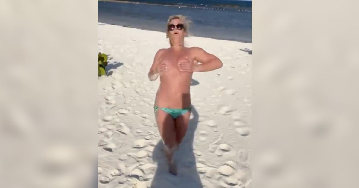 britney spears runs topless falling sand resurfaced viral video watch