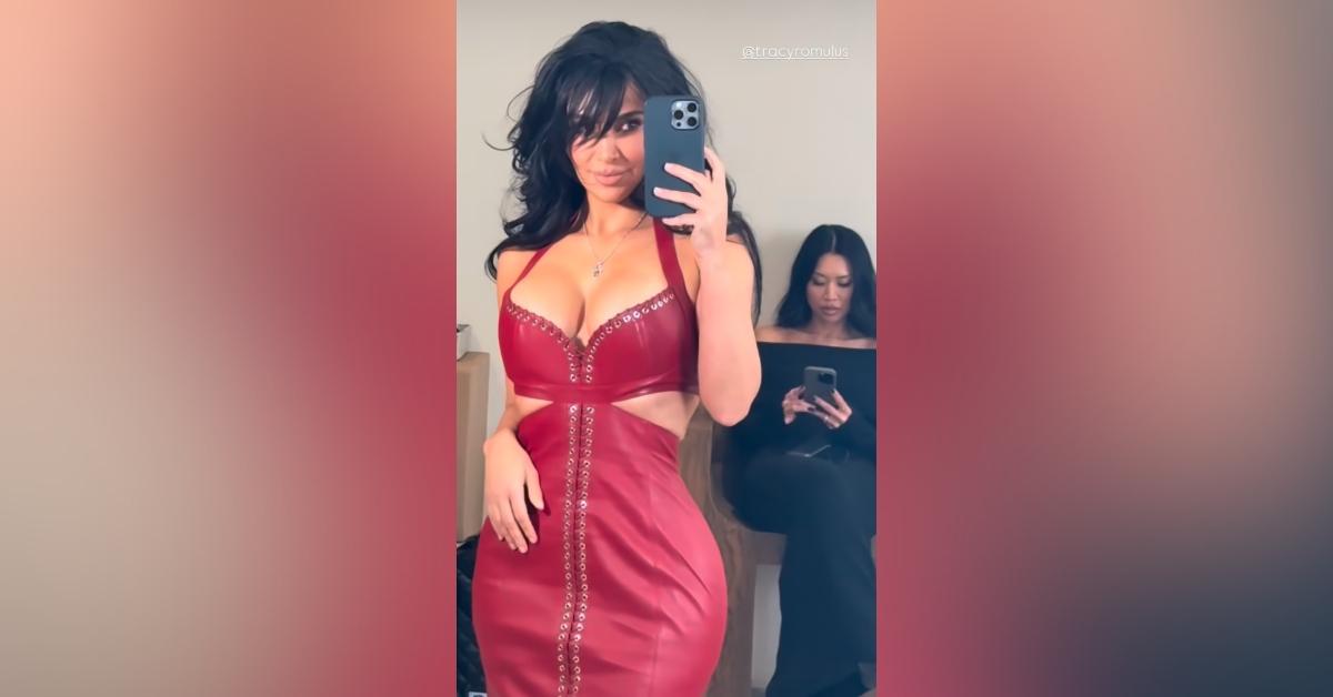 kim kardashian nearly spills out red gown photos