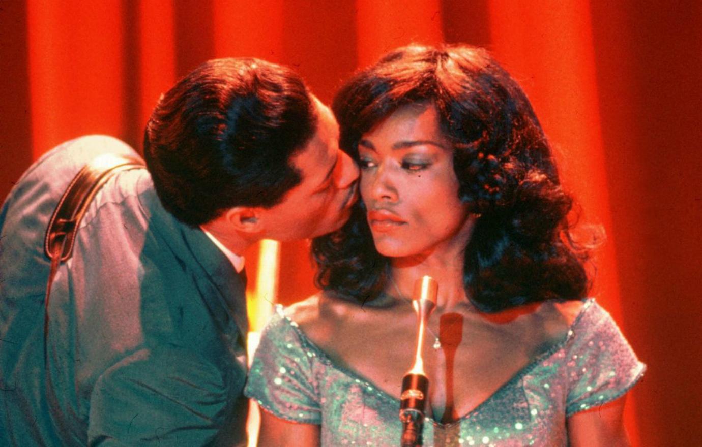 Angela Bassett was Tina Turner, dressed in a blue glittery dress, while Laurence Fishburne’s Ike Turner (in a matching blue suit) kissed her cheek.