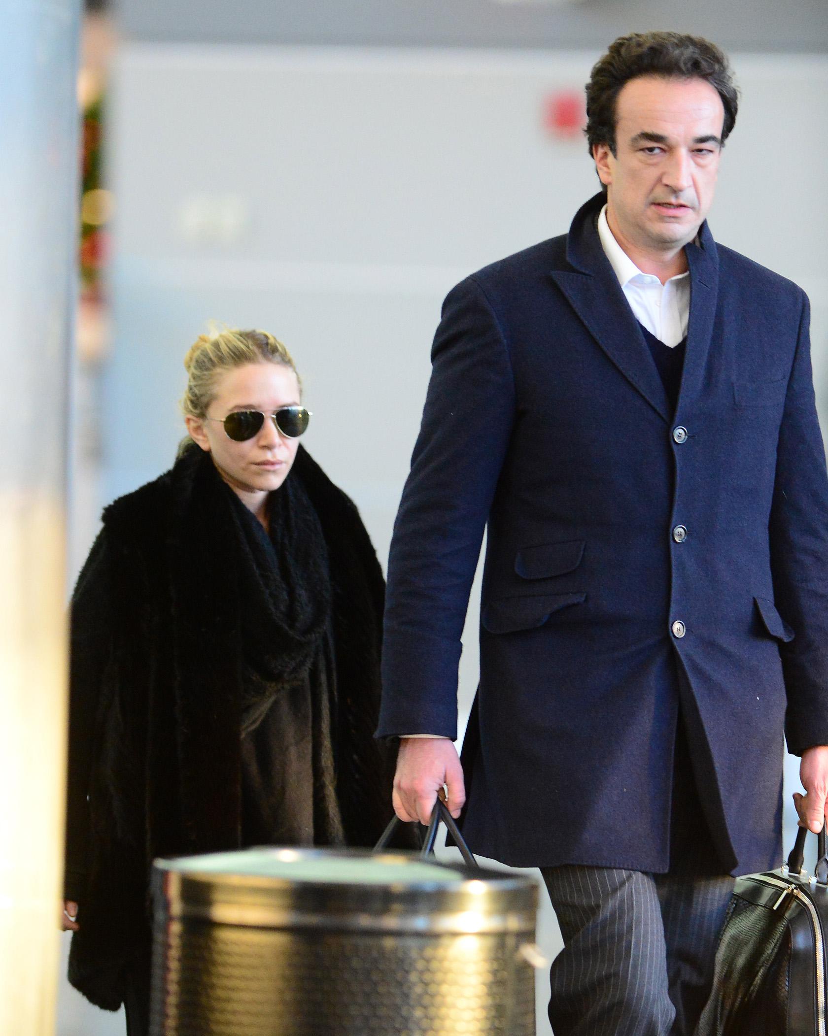 EXCLUSIVE: Mary Kate Olsen and Olivier Sarkozy arrive together at JFK Airport in New York, after departing from Los Angeles