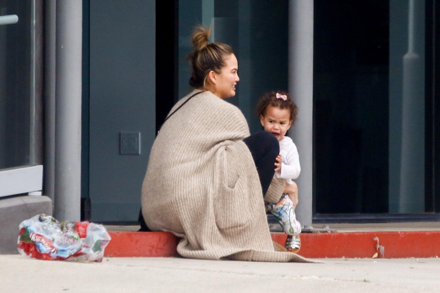 *EXCLUSIVE* Chrissy Teigen and John Legend shop at PC Greens with a cranky Luna