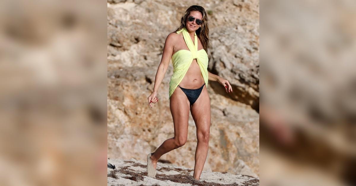 Image of Heidi Klum showed off her bikini body on the beach.