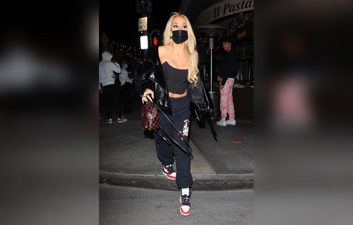 Tana Mongeau seen leaving Il Pastaio rocking a black leather jacket.