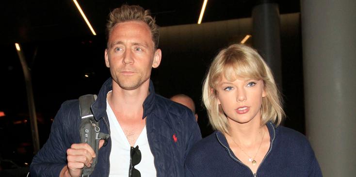 Taylor Swift &amp; Tom Hiddleston continue their world tour as they fly out of Los Angeles surrounded by several bodyguards.  The &#8220;1989&#8221; singer &amp; &#8220;The Avengers&#8221; actor were seen side by side as they caught a flight out of LAX.