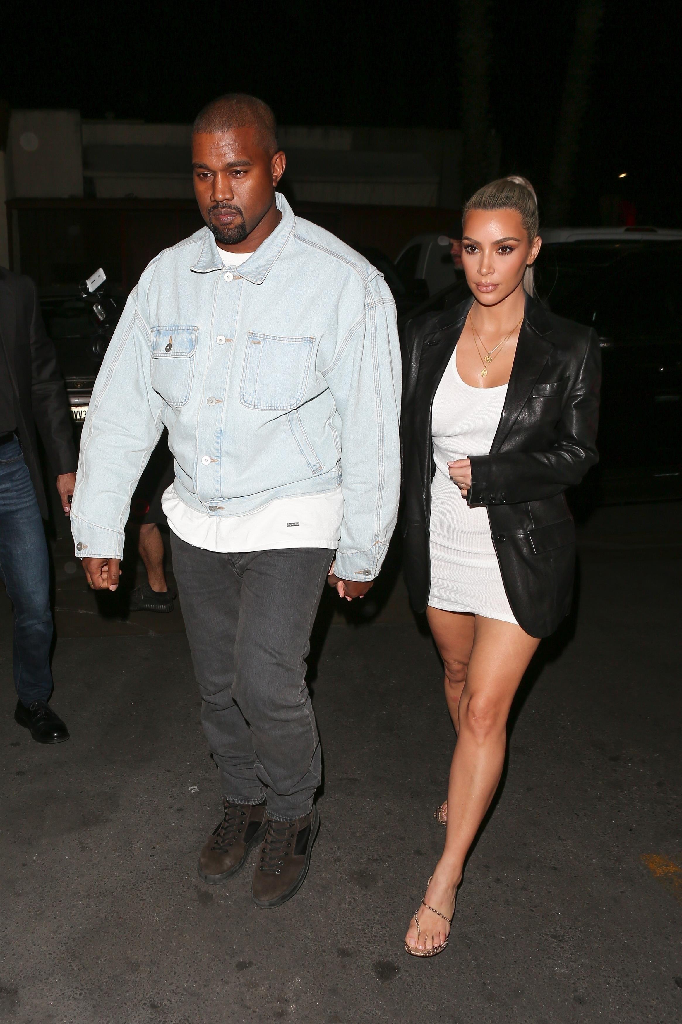 Kim Kardashian and Kanye West arrive for a birthday dinner party at Carousel Restaurant