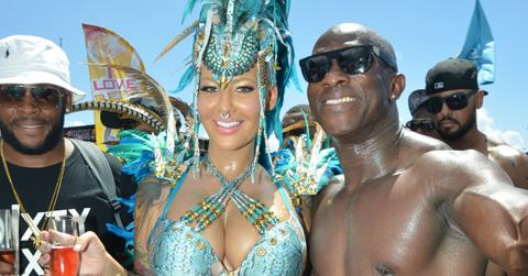 EXCLUSIVE: Amber Rose parties with fans in a very revealing show girl style costume, with a large head dress at 2015 Carnival (the largest party in the world) in Trinidad