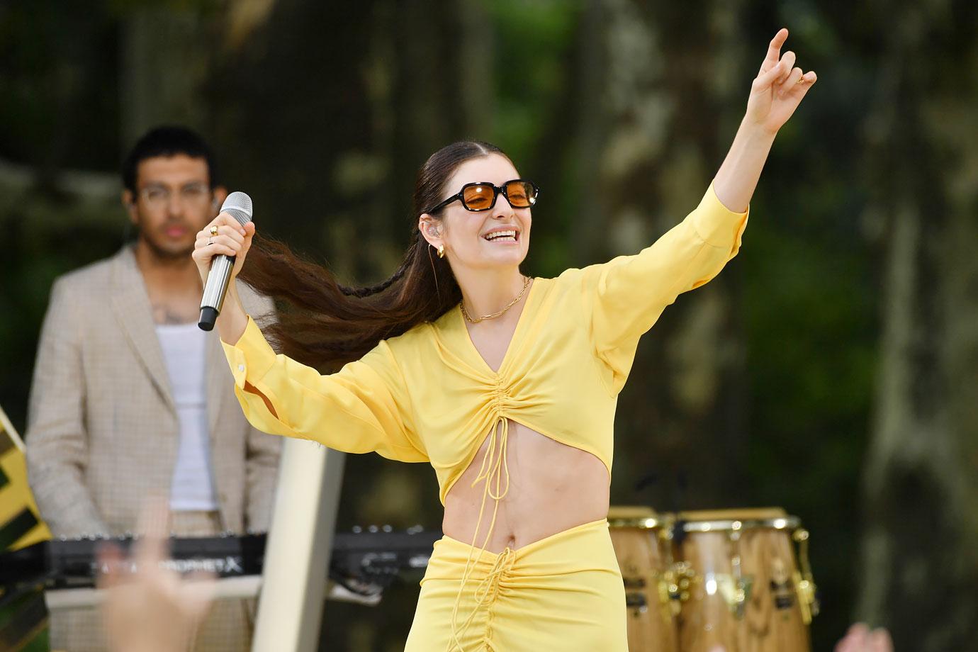 lorde wearing yellow performing on good morning america summer concert series