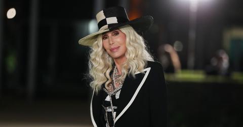 Photo of Cher in black and white outfit.