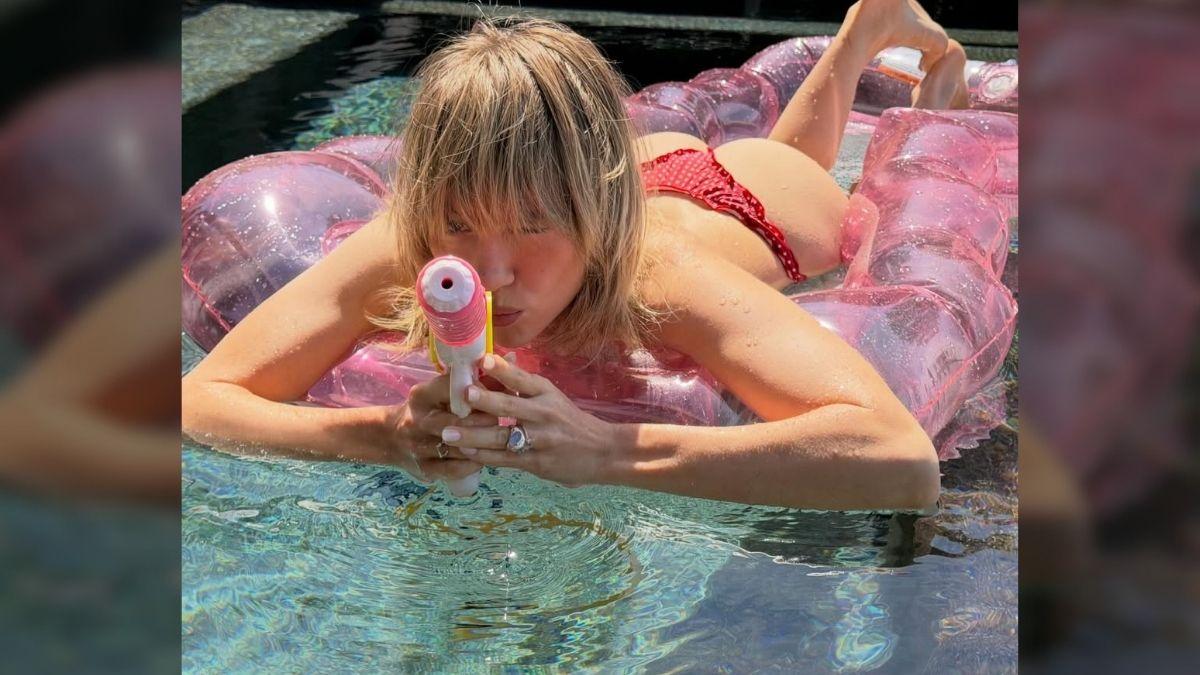 Photo of Suki Waterhouse showed off her curves in the barely-there swimsuit.