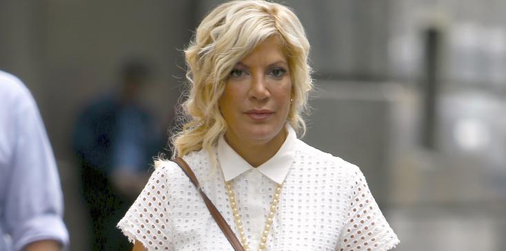 Tori Spelling Poses With Mickey Mouse In NYC