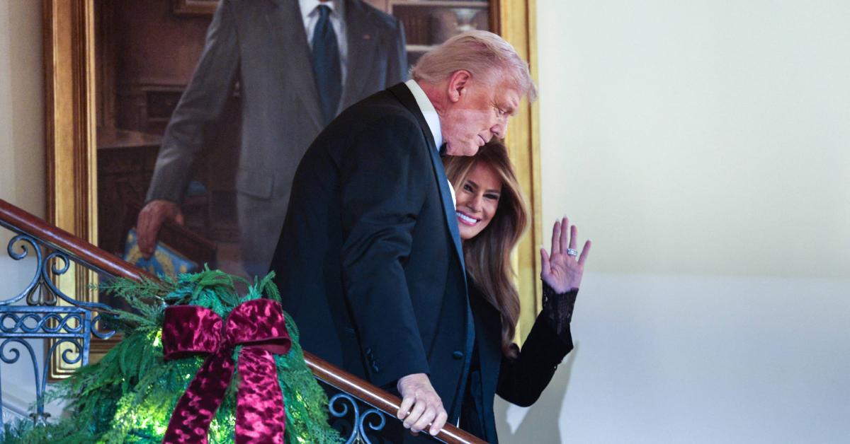 Image of Donald Trump gripped the handrail while descending from a staircase in the White House.