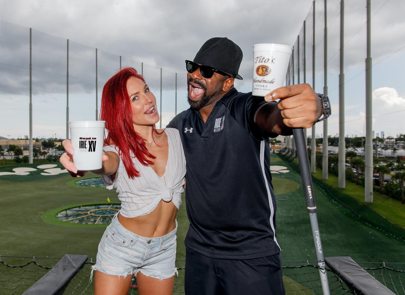 Sharna Burgess Poses With Drinks On Golf Course with DJ Irie