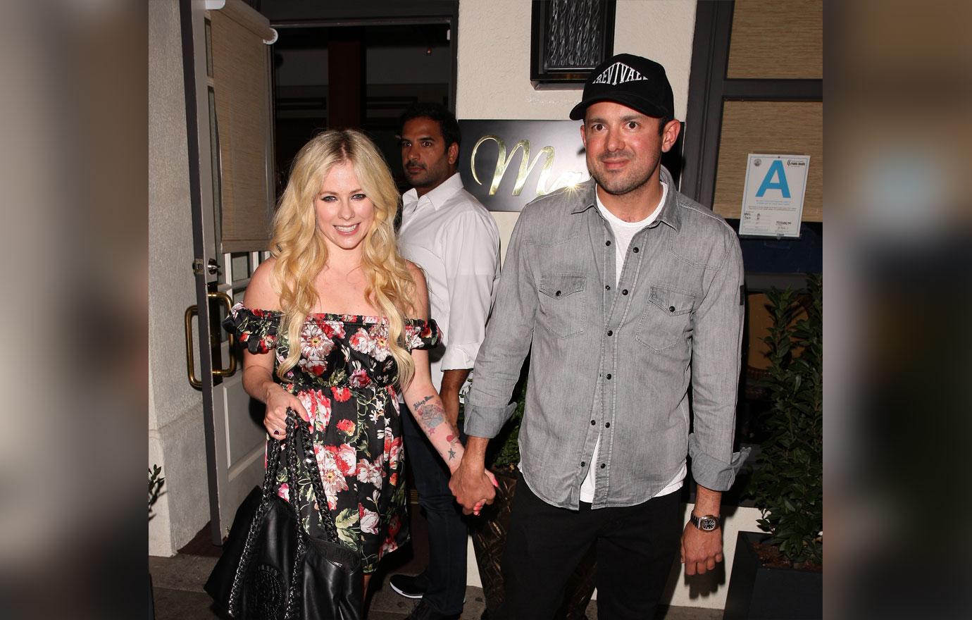 Avril Lavigne and Phillip Sarofim are spotted leaving Italian restaurant Madeo after having a romantic dinner