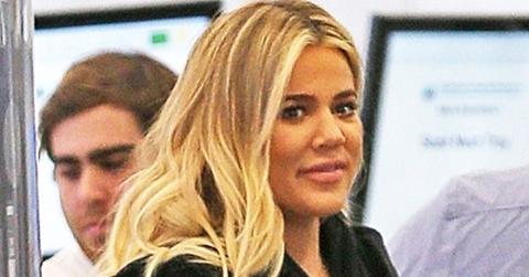Khloe Kardashian hides her baby bump as she departs LAX