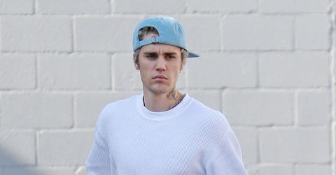 Justin Bieber In Blue Hat Looking Stressed