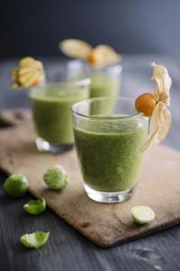 23 Feb 2015 --- Green smoothie with brussel sprout, banana and apple juice garnished with physalis --- Image by © Ina Peters/Westend61/Corbis