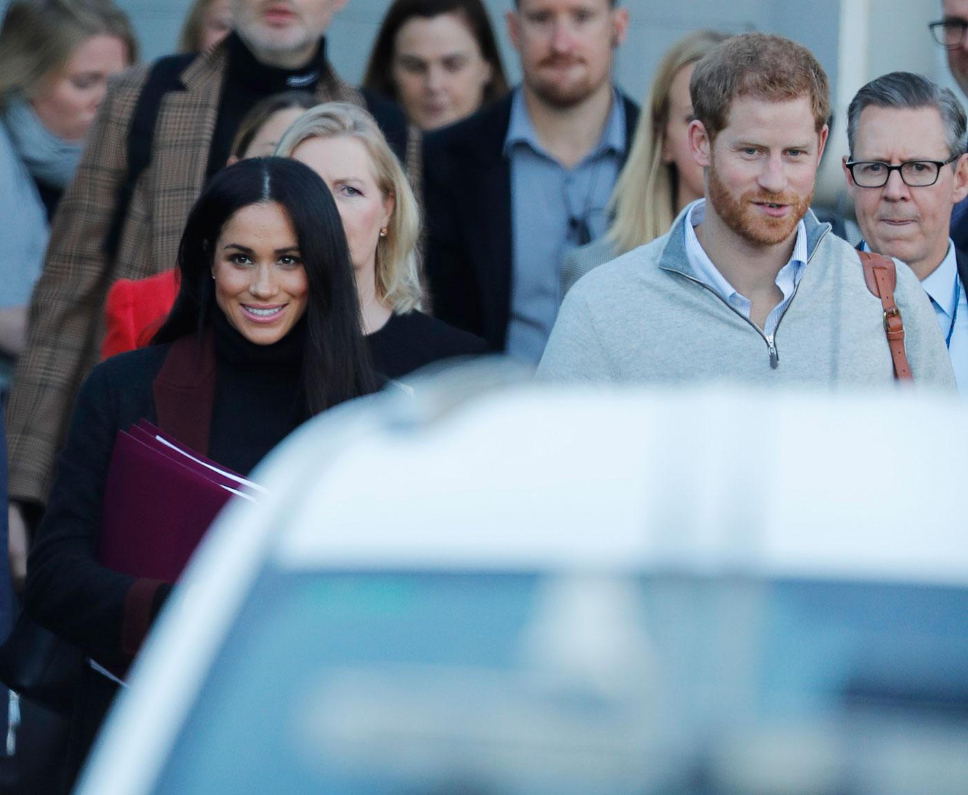 Prince Harry and his wife Meghan Markle pictured arriving in Sydney.