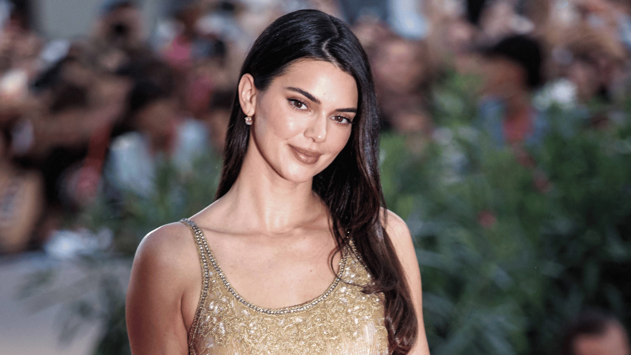 Image of Kendall Jenner shimmered in an archival gold Giorgio Armani gown from 1995.
