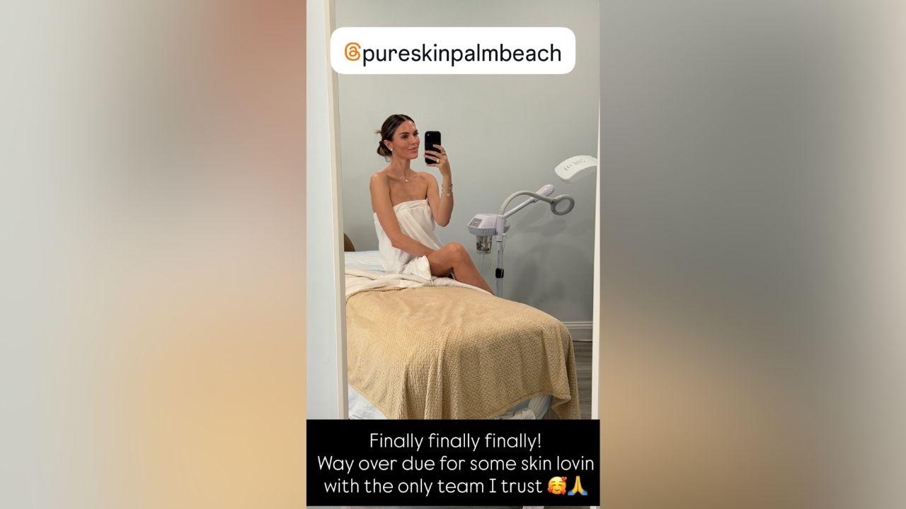 image of Bettina Trump shared a mirror selfie from Pure Skin Palm Beach, posing on a treatment bed while wearing a white towel.