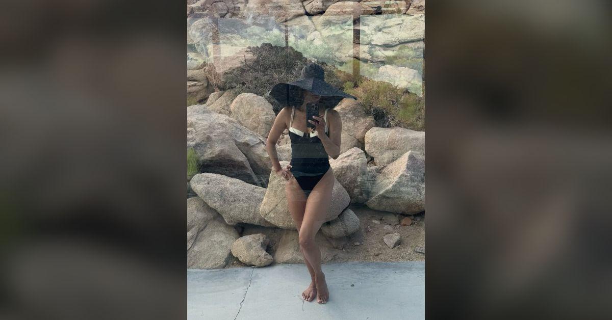halle berry flaunts ageless physique cleavage baring swimsuit photos