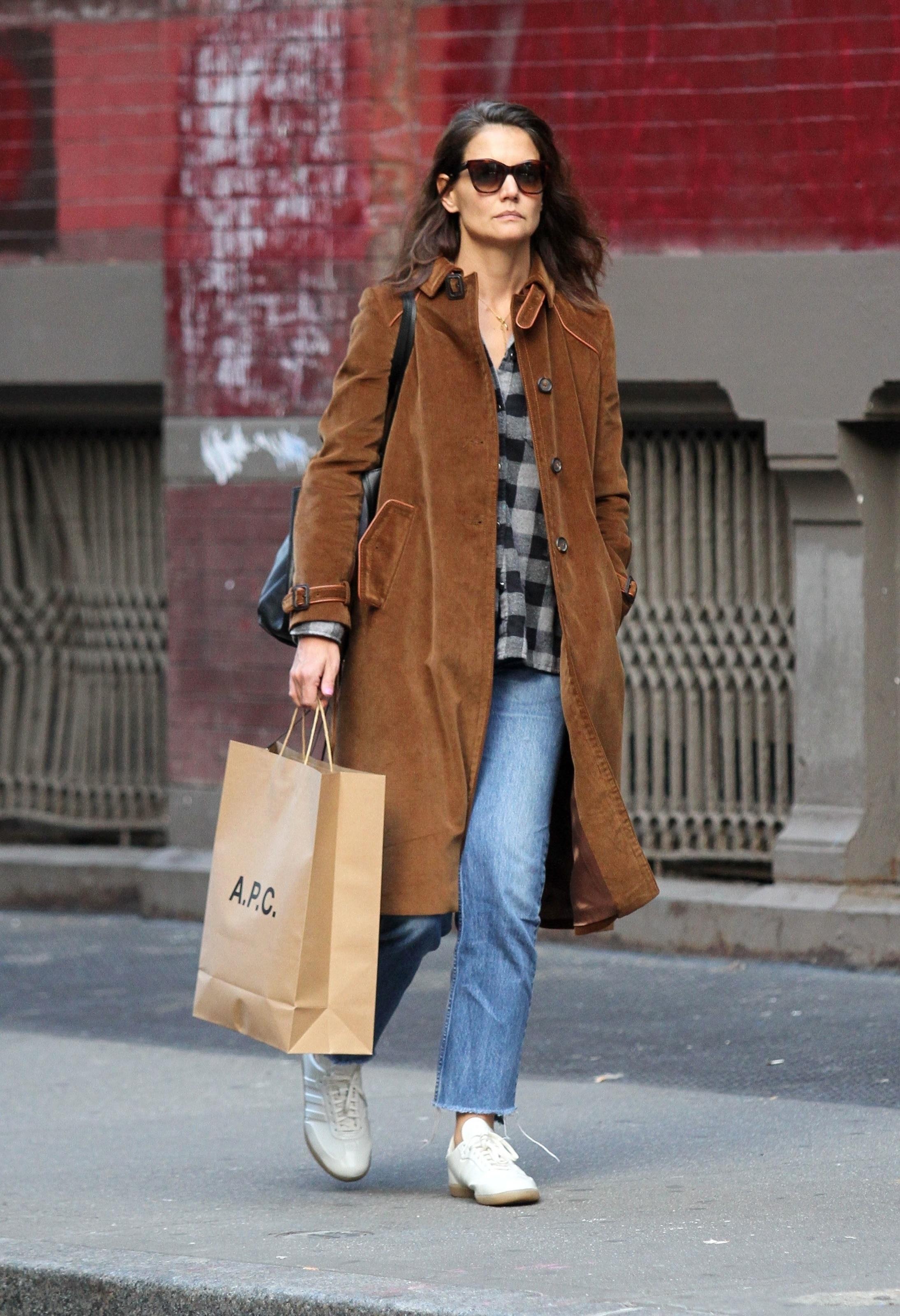 Katie Holmes rides a crowded subway train in NYC