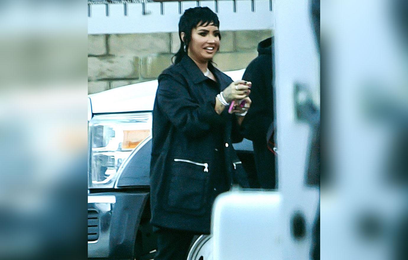 demi lovato sports a funky mullet while on the set of a music video with rapper g eazy in los angeles