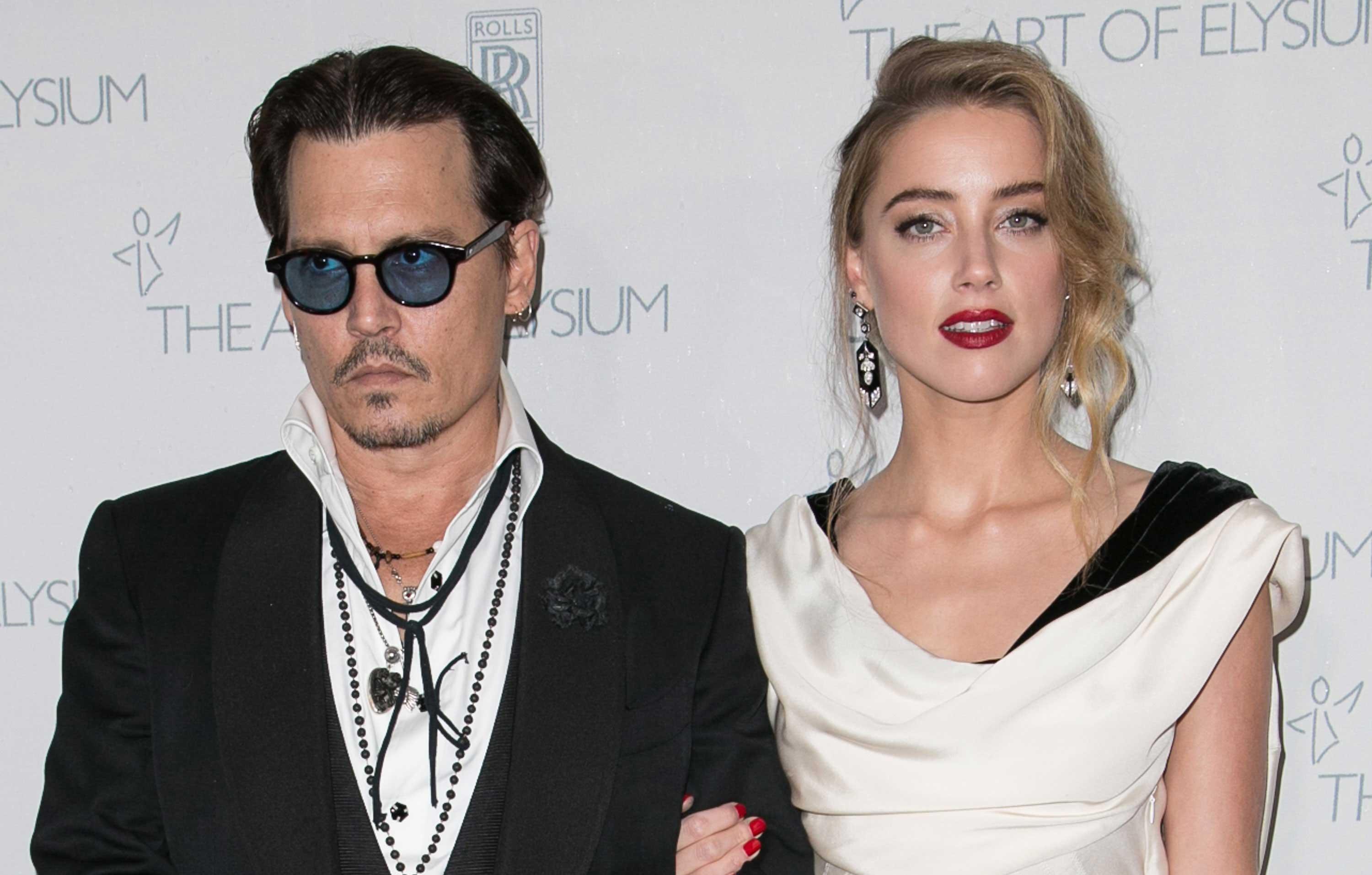 amber heard relaxes on vacation with pal who was banned from johnny depp trial