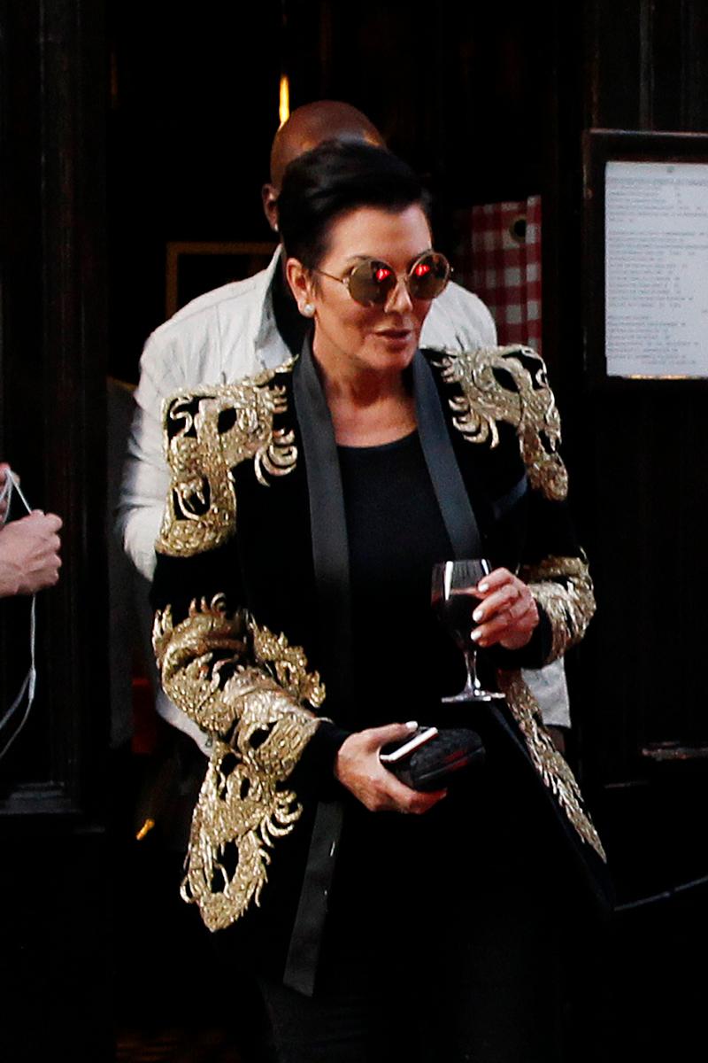 Kris Jenner and Corey Gamble leaving the Chez L&#8217;Ami Louis restaurant with a glass of wine in hand in Paris, France