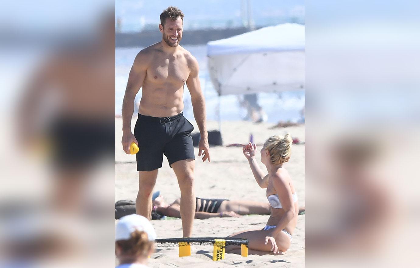 EXCLUSIVE: Julianne Hough wears a tiny bikini at the beach while playing Spike Ball with surfing husband Brooks Laich