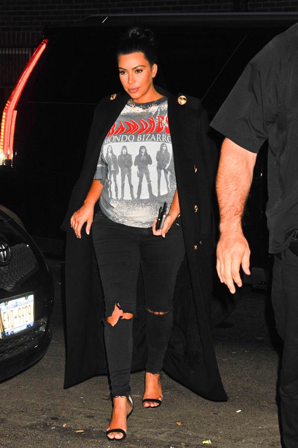 Pregnant, Kim Kardashian in a Ramones t shirt and ripped black jeans arrives at Carbone