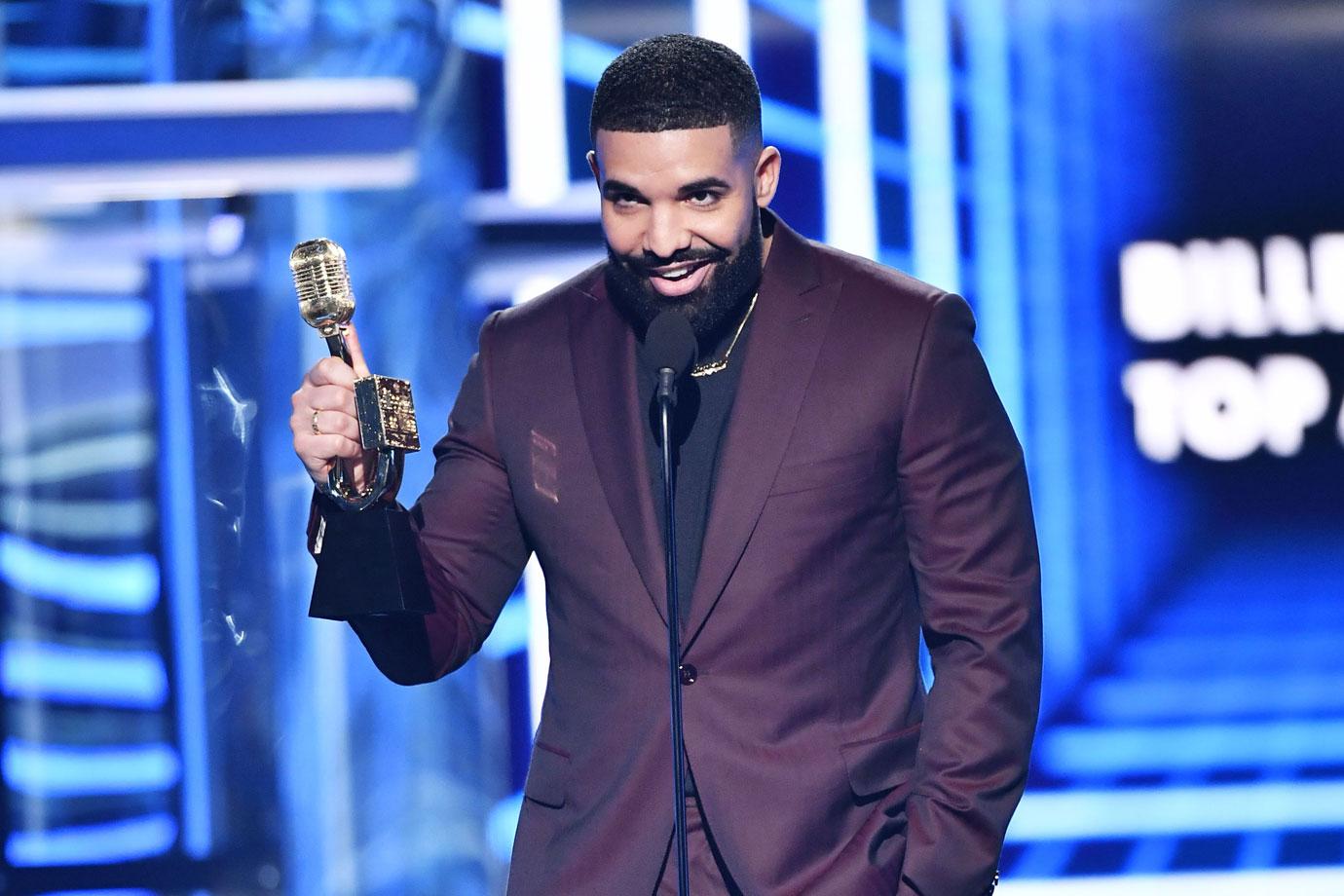 Drake holding awards