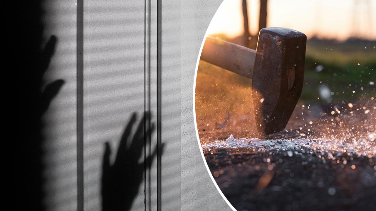 Image of person with hands up in shadows and hammer striking