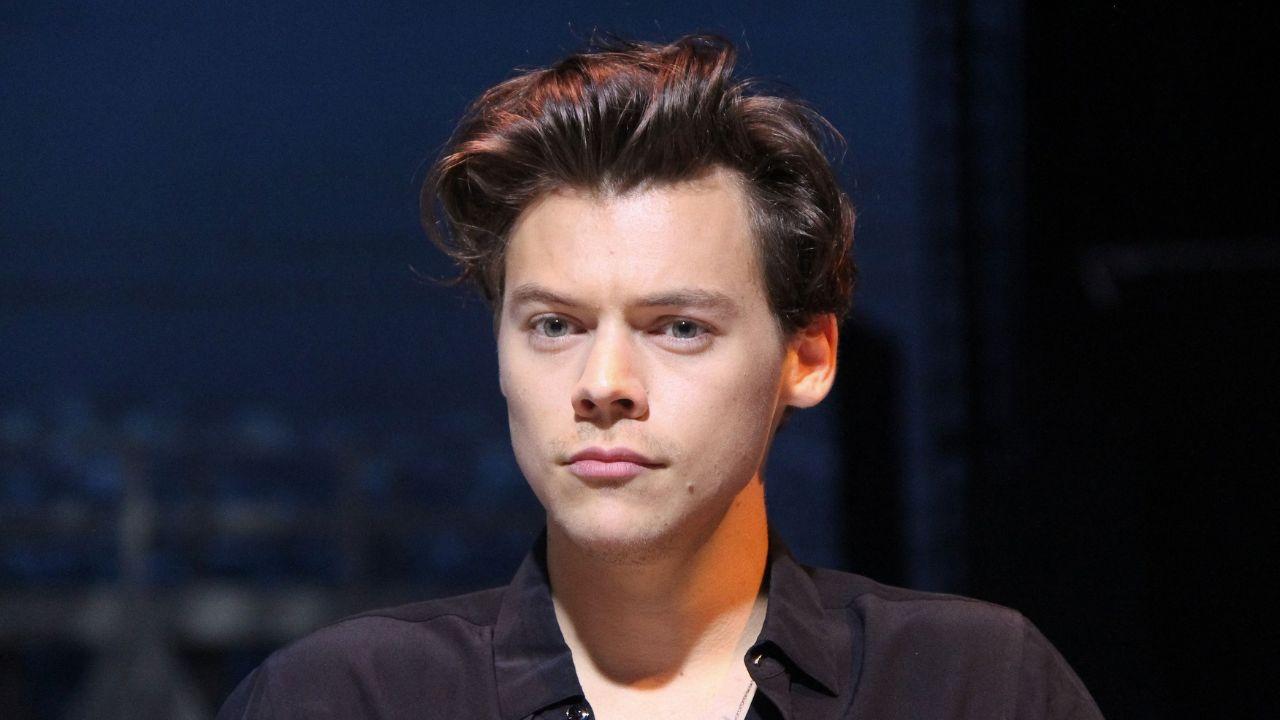 image of Harry Styles revealed that a past girlfriend helped him feel more comfortable going out in public after years of feeling isolated.
