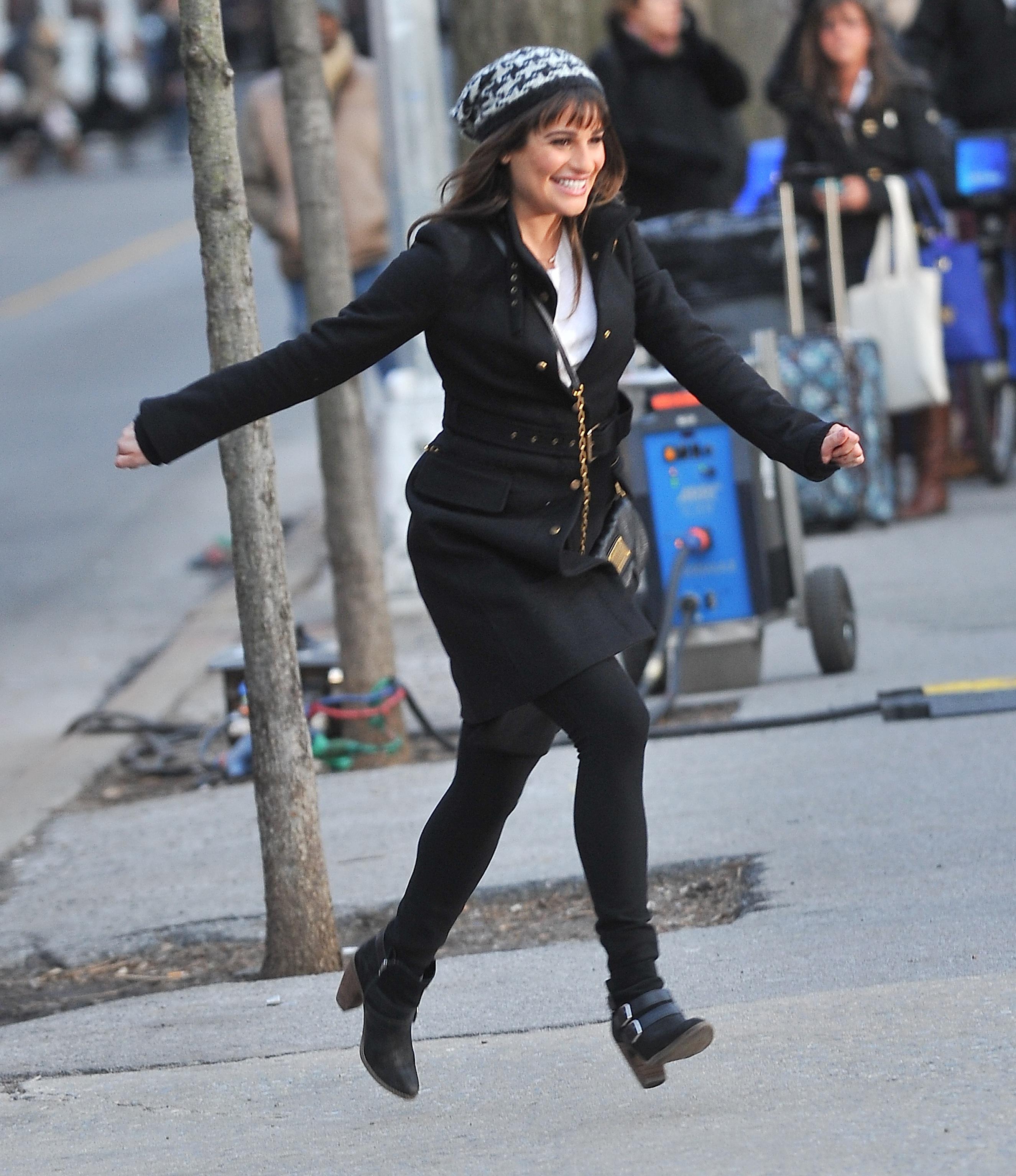 Lea Michele hops out of a car on set of &#8220;Glee&#8221; today in NYC