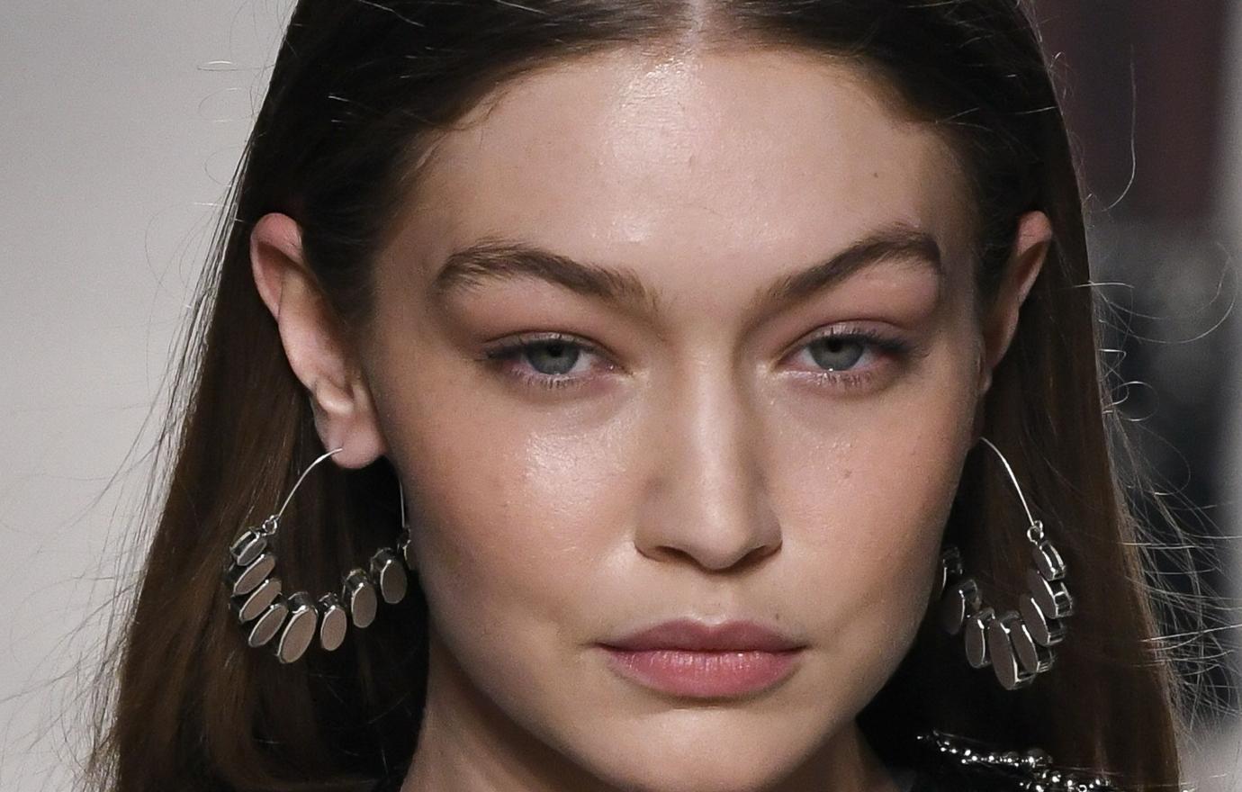 Gigi Hadid walked the runway in an Isabel Marant black dress with pronounced shoulder pads.