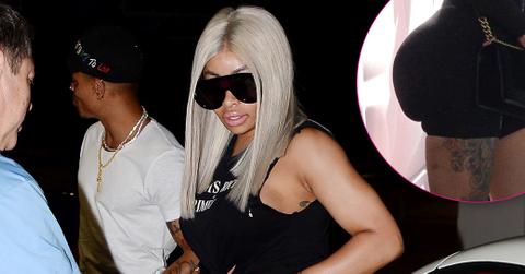 Blac Chyna gives a peek at taut tummy in knotted and distressed top while out with beau Mechie in Los Angeles