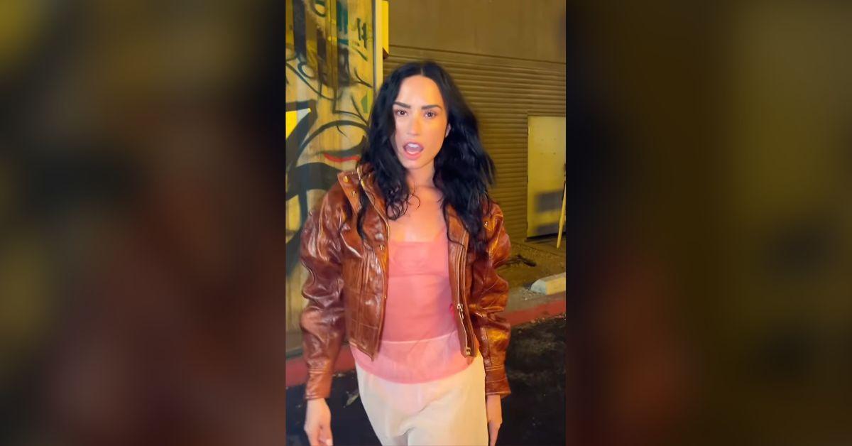 demi lovato flaunts lean physique see through top new music watch
