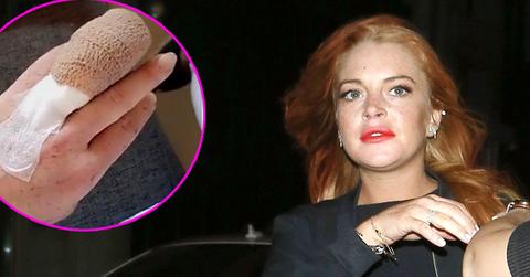 Lindsay Lohan and a friend pose for photos leaving the Libertines nightclub at 3am