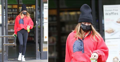 hailey bieber picks up a green juice in la