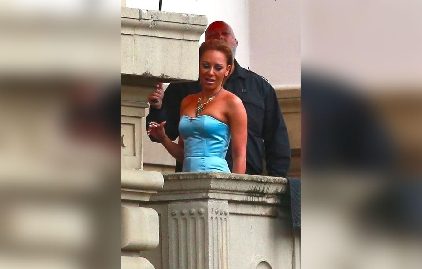 Mel B makes sure she smells good during a cigarette break