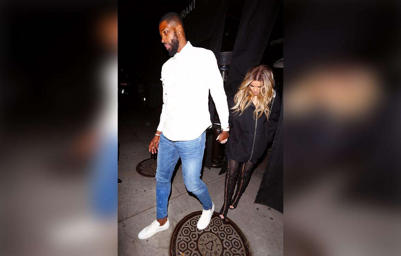 Khloe Kardashian and Tristan Thompson kiss during a dinner date in Beverly Hills