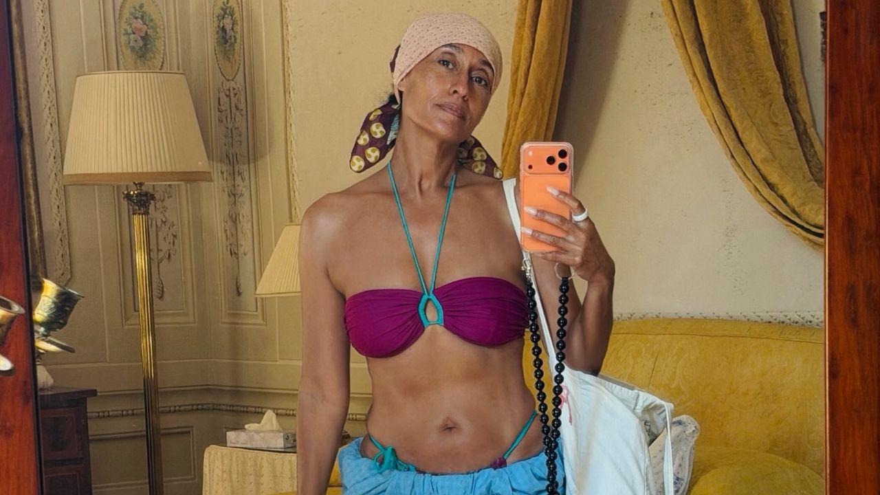Image of Tracee Ellis Ross flaunted her toned physique in a colorful bandeau bikini while snapping a vacation mirror selfie.