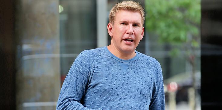 TV personality and real estate broker Todd Chrisley and his son, Chris Chrisley, check out of Trump Soho Hotel on May 15, 2015 in New York City