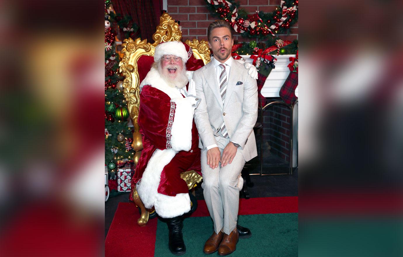 **EXCLUSIVE**  Photo Credit: MOVI Inc.  Date: November 16th 2017Derek Hough takes a seat on Santa&#8217;s knee before hosting The Americana At Brand&#8217;s Christmas Tree lighting show in Glendale,CA.