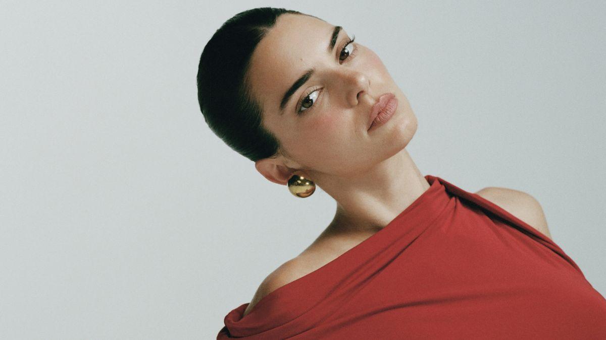 image of Kendall Jenner recently wore low-rise pastel yellow mini shorts.